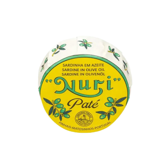 A round package of Nuri Pate Sardine in Olive Oil, featuring a bright yellow and white label with green olive branch illustrations on a plain white background.